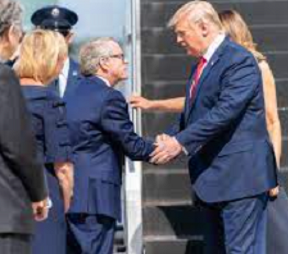 Dewine shaking hands with Trump