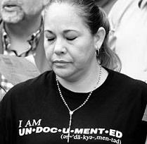 Black and white photo of latina woman with her eyes closed