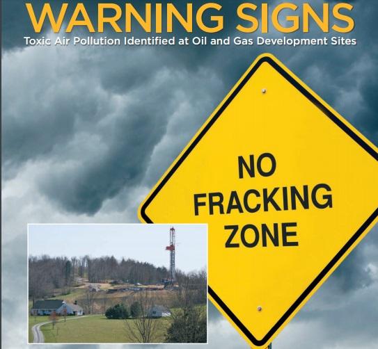No Fracking Zone sign like a Yield sign and a photo of a fracking site