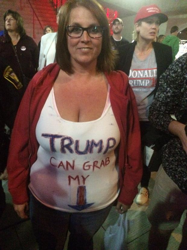 Woman wearing Trump can grab my...