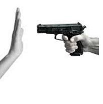 Someone pointing a gun with a side view and someone holding up their hand in front of it