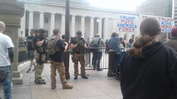 Guy with semi automatic guns at statehouse