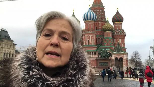 Close up of Jill Stein with famous Moscow building in background