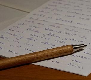 Written letter and a pen