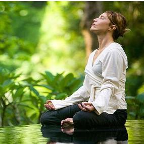 Woman meditating outside