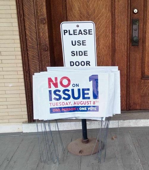 Yard signs on porch