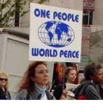 Woman holding sign saying One People World Peace