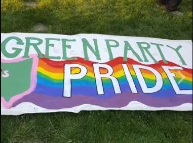 Banner in rainbow colors saying Green Party Pride
