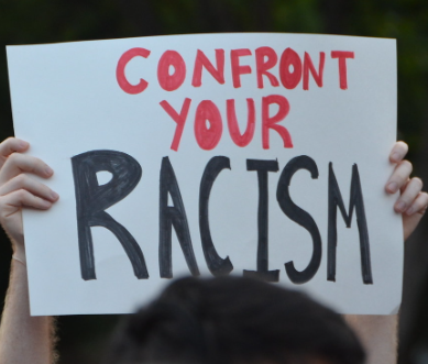 Sign saying confront your racism