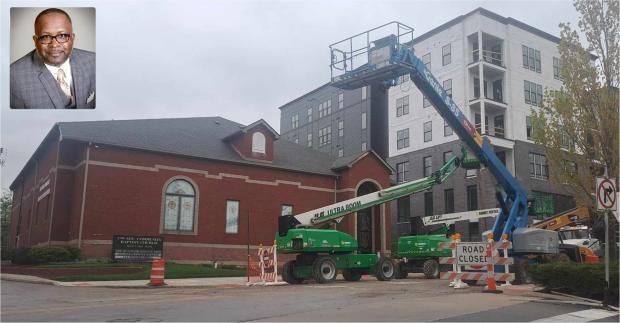 Pastor Robey and the church with construction going on around it