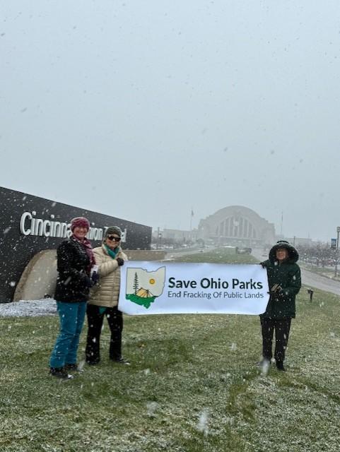 People holding Save Ohio Parks banner