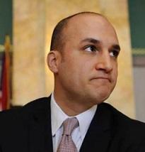 Balding white man in a suit looking determined