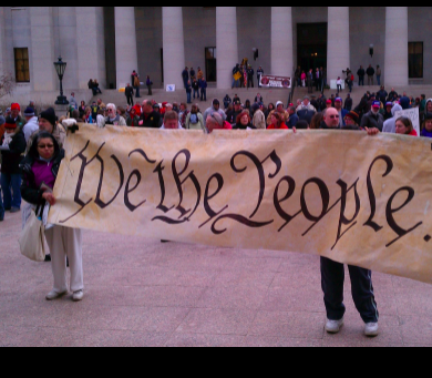 Sign saying We The People