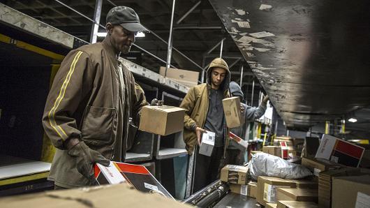 People working with boxes at UPS