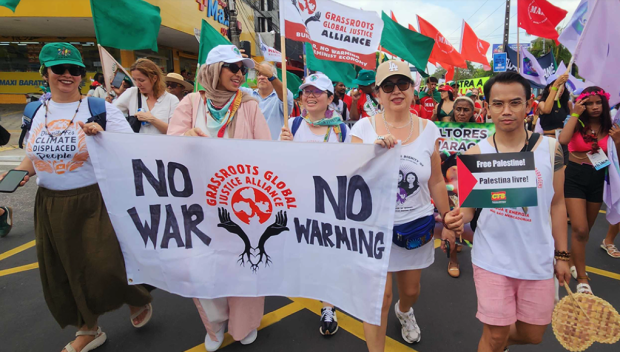 People marching and holding a banner