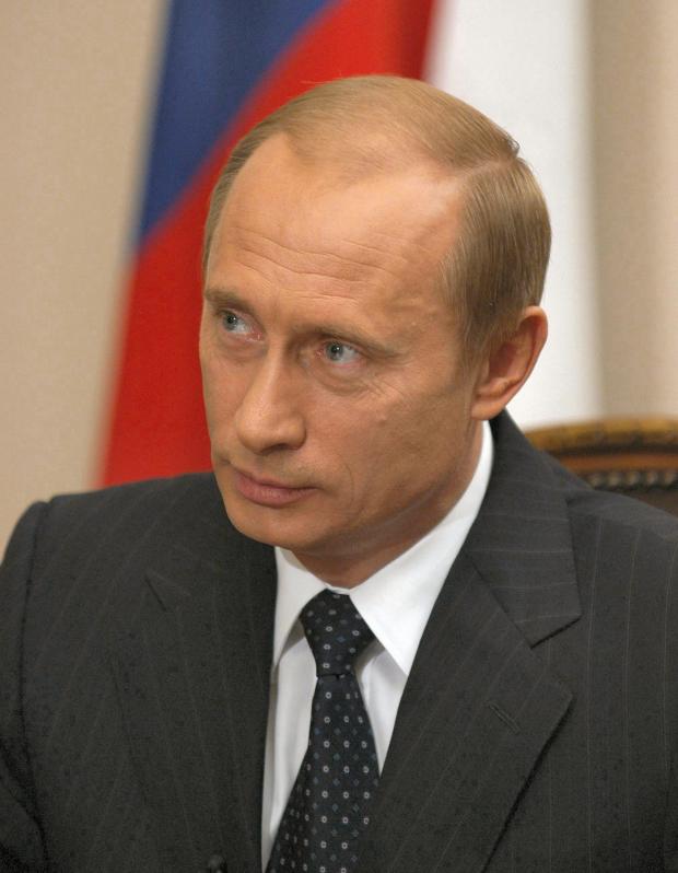 Putin's face, white guy with balding brown hair and a suit