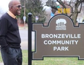 Willis Brown next to Park sign