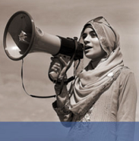 Woman in hijab talking into a megaphone