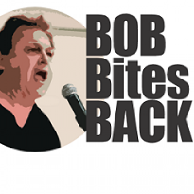 Words Bob Bites Back and a white man head and shoulders with black hair and black shirt shouting into a mic