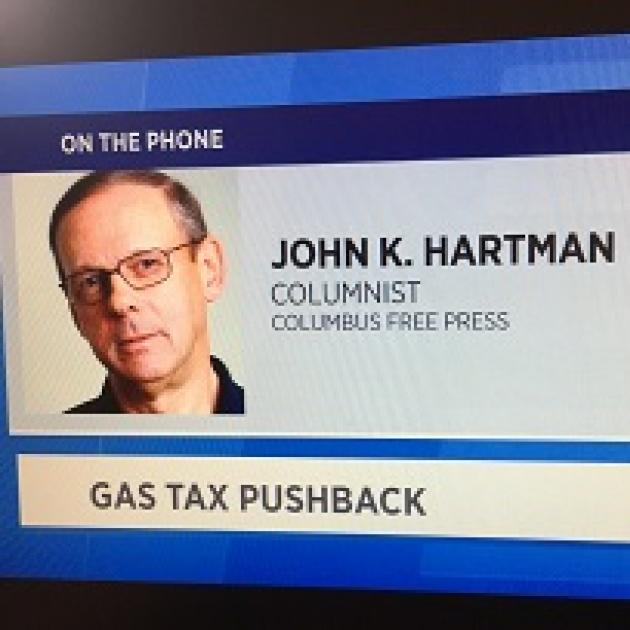 Screen shot of white man's head and the words John K. Hartman Columnist Columbus Free Press on the phone Gas Tax Pushback