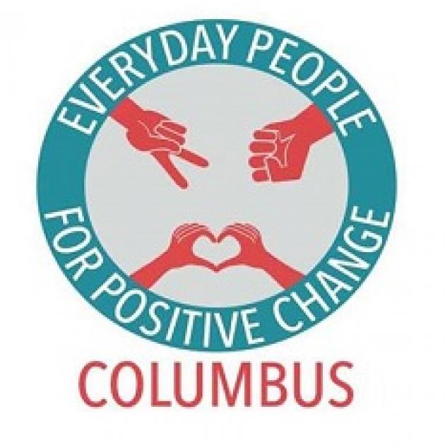 Blue circle with words Everyday People for Positive Change and the word Columbus at the bottom, red hands in the circle with peace sign, fist and making a heart