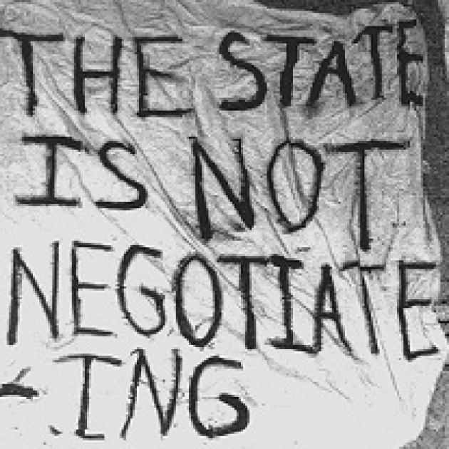 White banner with words The State is not negotiating