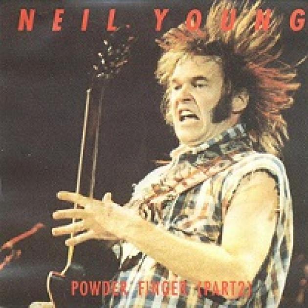 Man playing a guitar with his hair sticking straight up in the air and his face in a strange scowl he's wearing a plaid shirt without sleeves and he has long sideburns, the name Neil Young in red letters at top and Powderfinger below