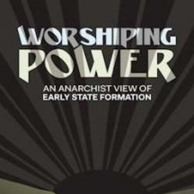 Cover of a book, the background is like a sun with rays spreading out but is black and gray. Words in white say Worshipping Power, an anarachist view of early state formation