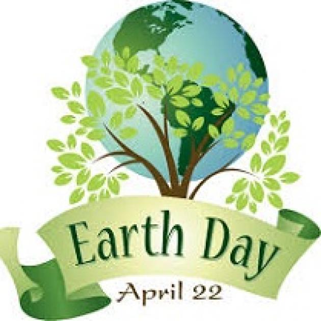 A drawing of the Planet Earth with a tree in front and a banner with the words earth day and April 22
