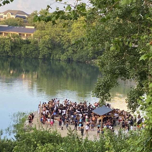 People gathered by a quarry