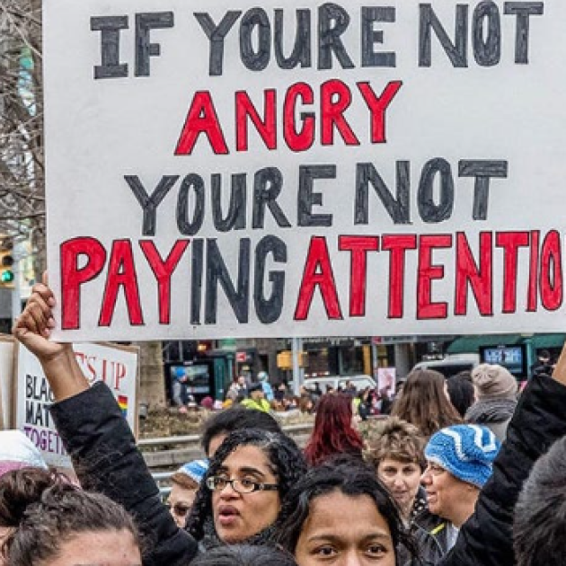 Sign saying If you're not angry, you're not paying attention