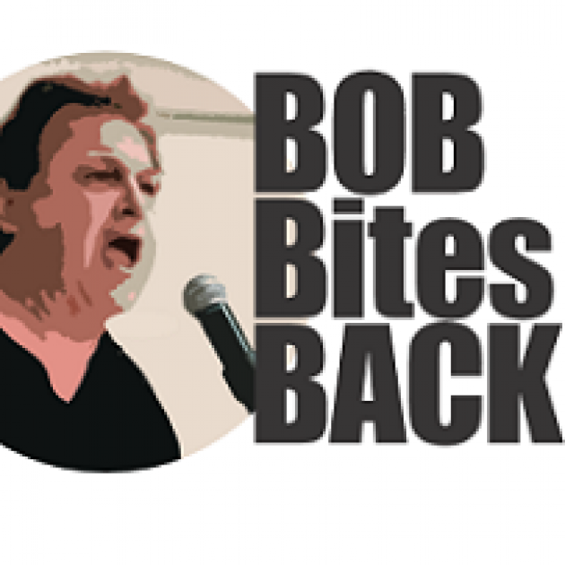 White middle aged man with black hair yelling into a microphone and words Bob Bites Back