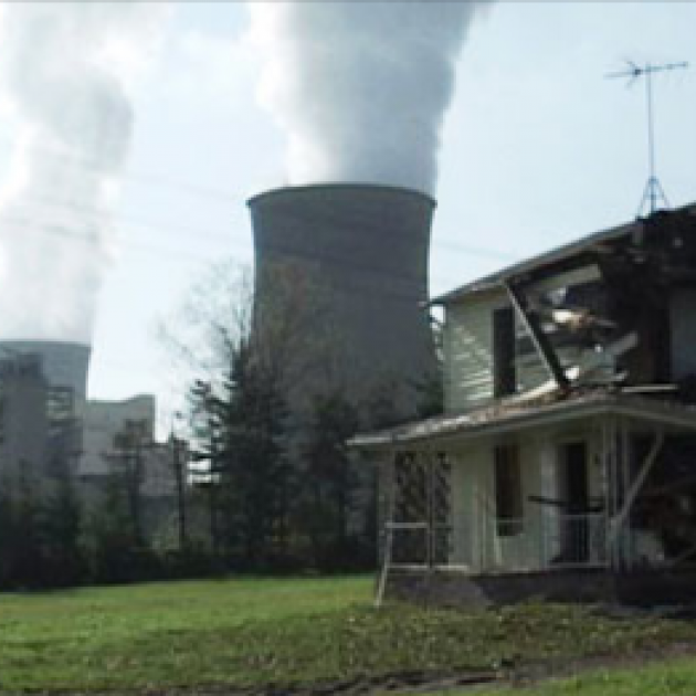 Broken down house and nuclear reactor spewing smoke