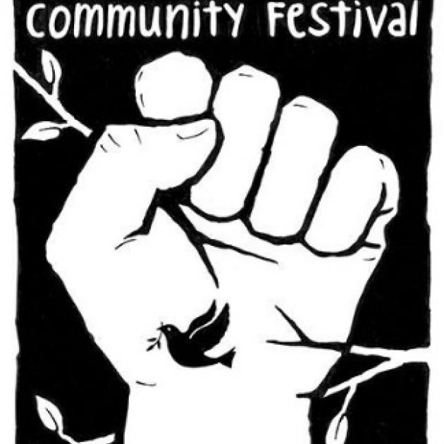 A fist with the words Community Festival