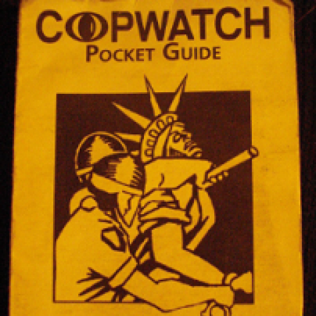 Yellow pamphlet with words Copwatch Pocket Guide at top and a drawing of two cops apprehending the Statue of Liberty