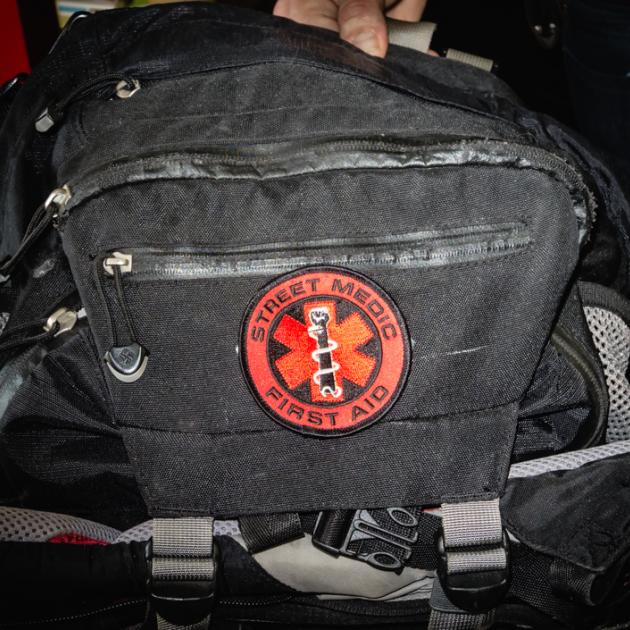 Black medic bag with red First Aid symbol on it