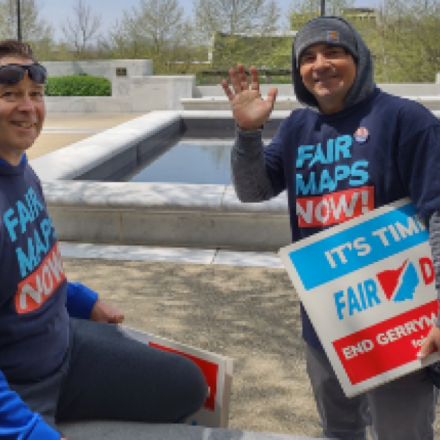 Guy with Fair Districts sign