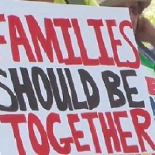 Sign saying families should be together