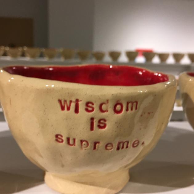 Coffee mug that says Wisdom is something