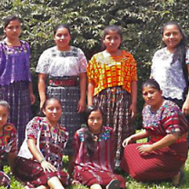 Lots of young Guatemalan girls in colorful dresses