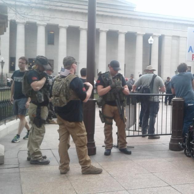 Guy with semi automatic guns at statehouse