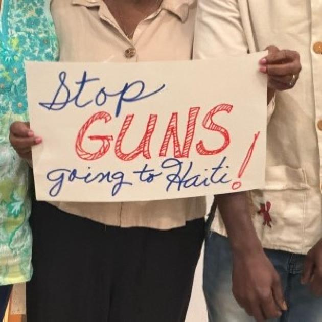 Sign saying Stop Guns going to Haiti