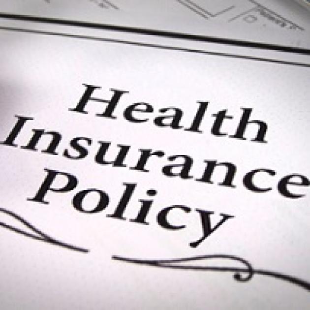 Words Health Insurance Policy with a squiggly line below