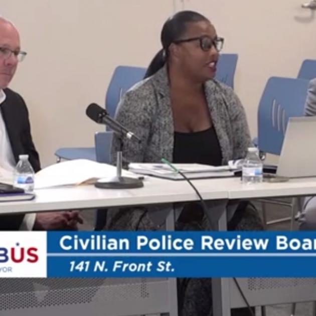 Three members of Civilian Review Board at a table
