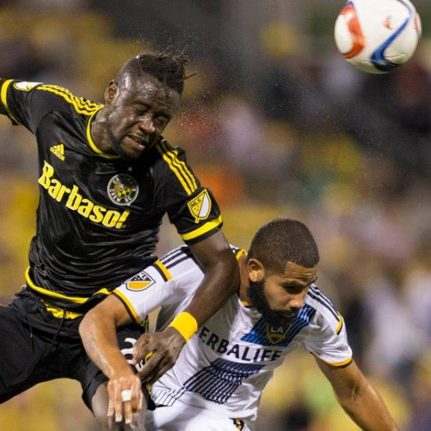 Kei Kamara (left) battles for a header against LA Galaxy defender Leonardo. (Photo courtesy of Crew SC)