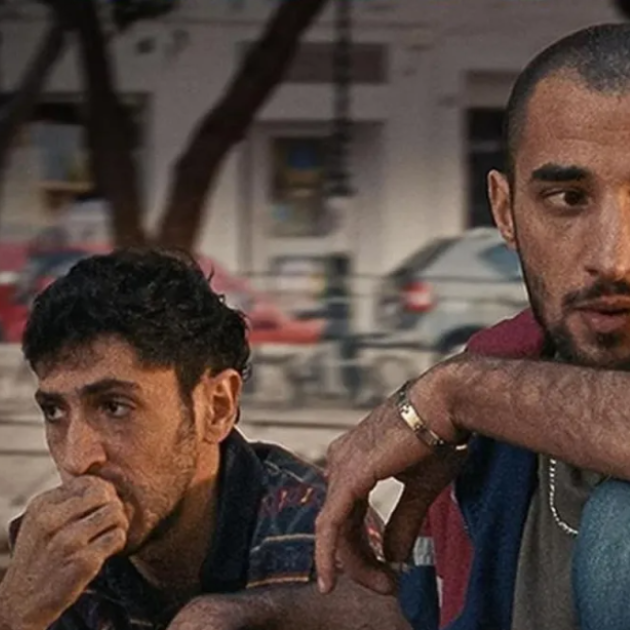 Two men sitting together