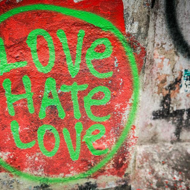 Love Hate Love spray painted on a wall