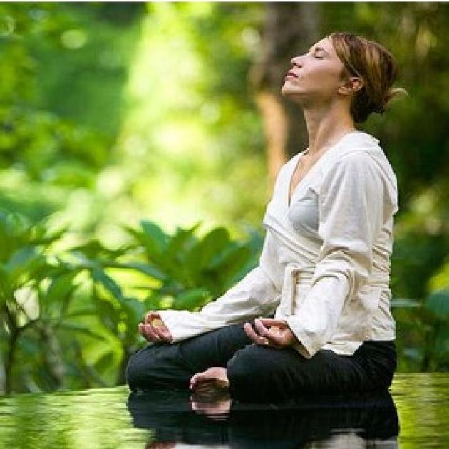 Woman meditating outside