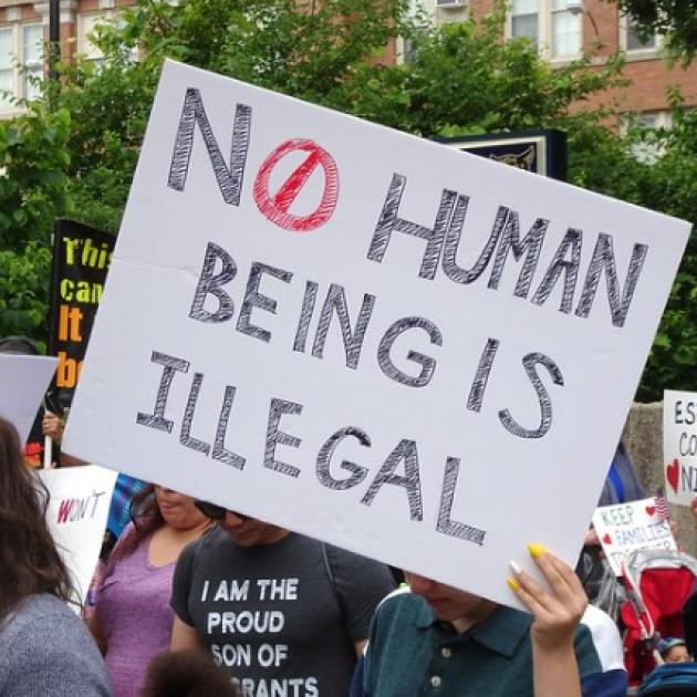 No Human Being is Illegal sign