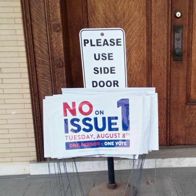 Yard signs on porch